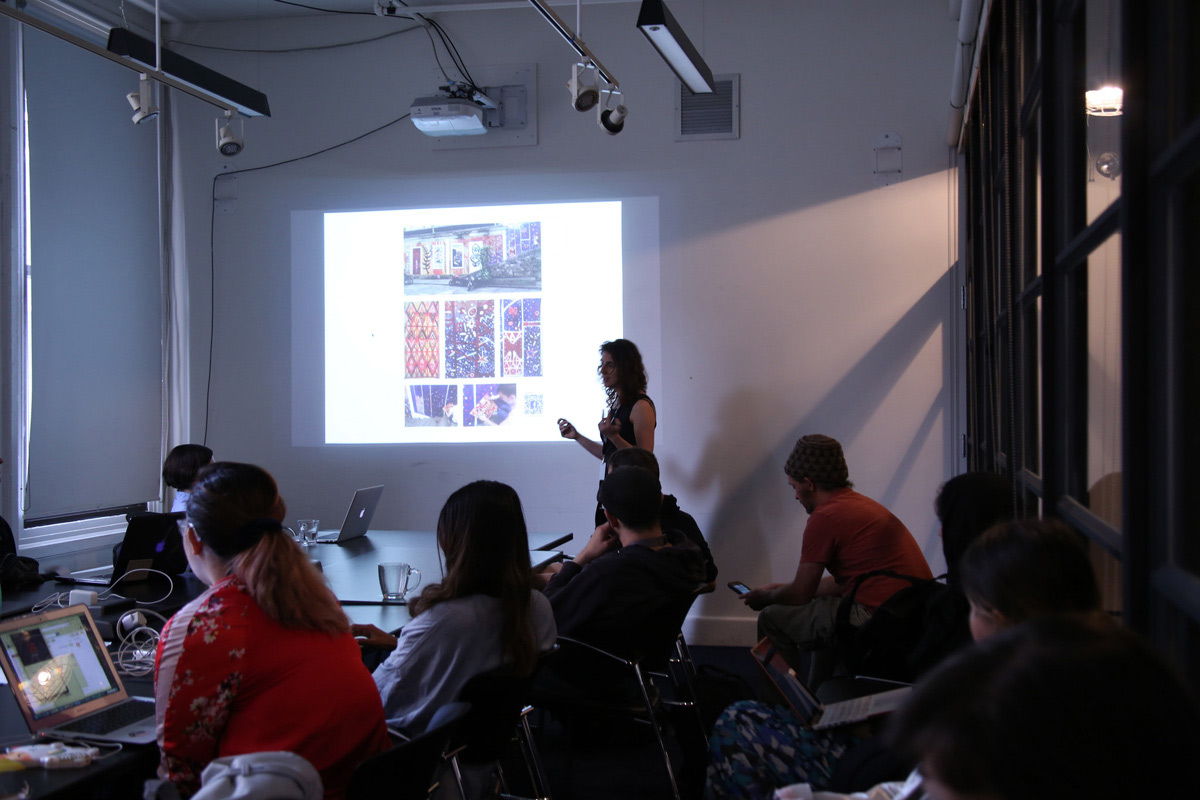 a lecture with a projection of textiles in a classroom